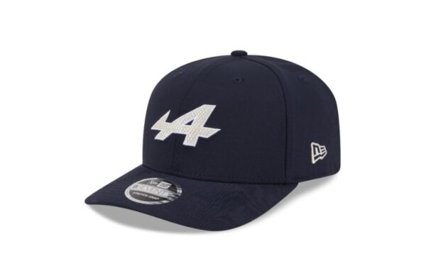 Represent the bold spirit of Alpine F1 Team with this eco-conscious New Era 9SEVENTY cap in a deep navy finish. Featuring a structured crown and a curved visor, this stylish hat blends motorsport passion with sustainable design. The front proudly displays the Alpine logo in raised embroidery, while the back features an adjustable snap closure for a secure and comfortable fit. Made with recycled materials, it's a smart choice for fans who care about performance and the planet.
