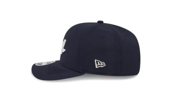 Represent the bold spirit of Alpine F1 Team with this eco-conscious New Era 9SEVENTY cap in a deep navy finish. Featuring a structured crown and a curved visor, this stylish hat blends motorsport passion with sustainable design. The front proudly displays the Alpine logo in raised embroidery, while the back features an adjustable snap closure for a secure and comfortable fit. Made with recycled materials, it's a smart choice for fans who care about performance and the planet.