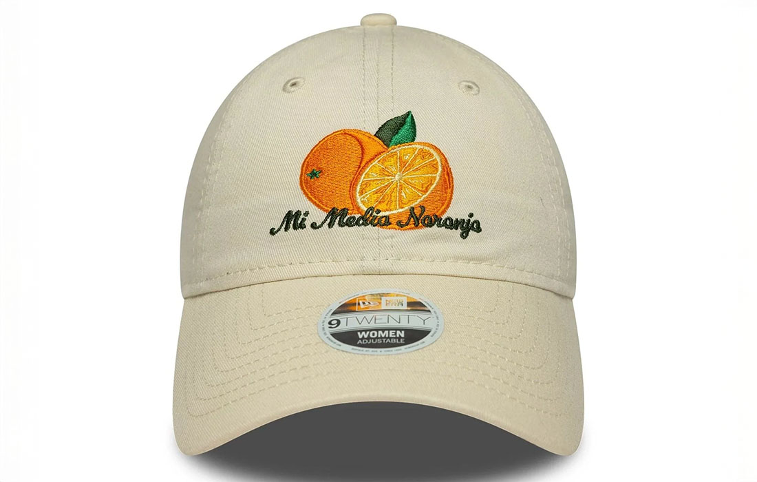 60691303_1 front Women New Era Phrase Cream 9TWENTY Cap Orange graphic with Mi Media Naranja wordmark in Spanish on front New Era Flag embroidered on left Unstructured crown Strapback Curved visor 100% COTTON Product ID: 60691303