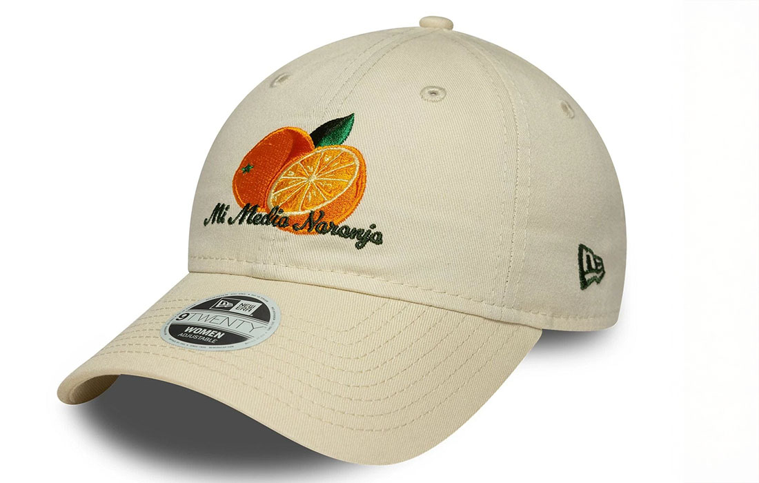 60691303_side Women New Era Phrase Cream 9TWENTY Cap Orange graphic with Mi Media Naranja wordmark in Spanish on front New Era Flag embroidered on left Unstructured crown Strapback Curved visor 100% COTTON Product ID: 60691303