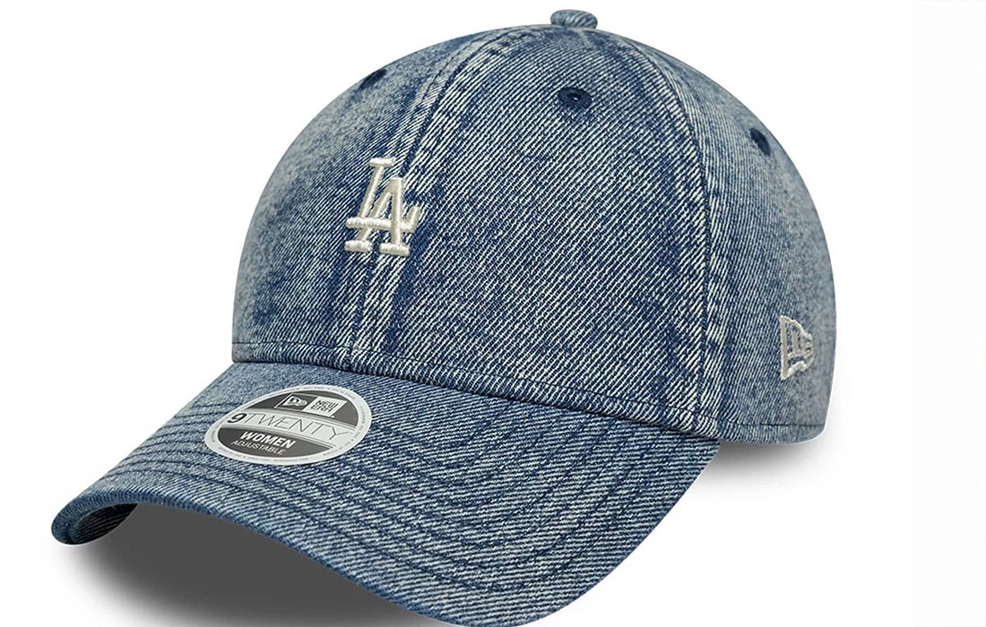 60758965 side Womens MLB Denim LA Dodgers Blue 9TWENTY Cap LA Dodgers mini logo on front New Era Flag embroidered on left Unstructured crown Strapback Curved visor Made with washed effect denim fabric 65% POLYESTER, 35% COTTON